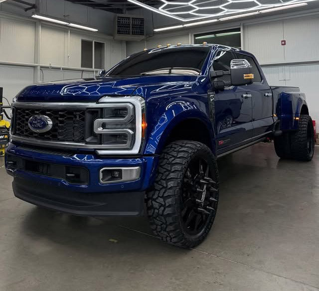 Blue Ford Powerstroke Diesel Truck in garage