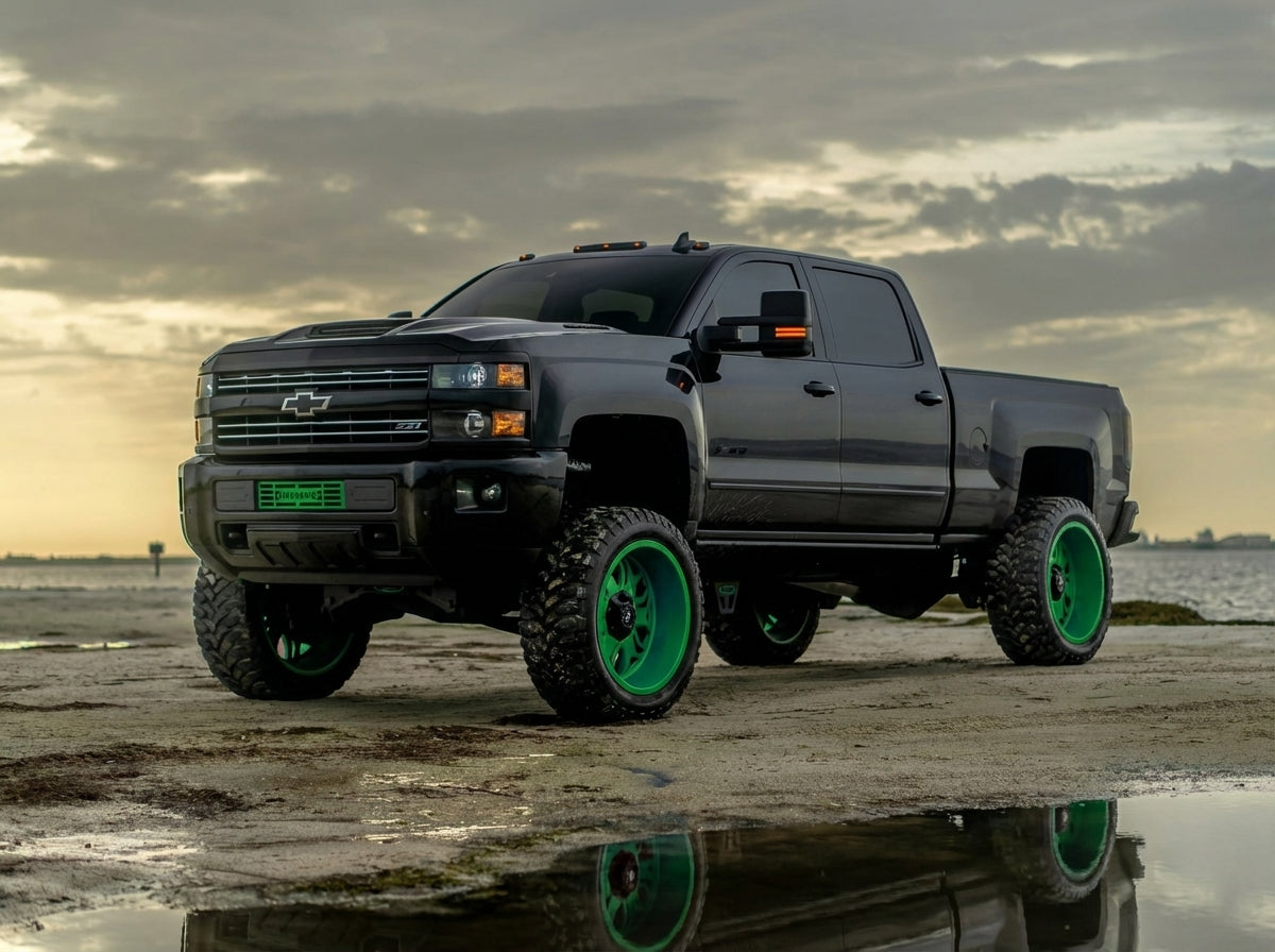 Black GM Duramax with green wheels